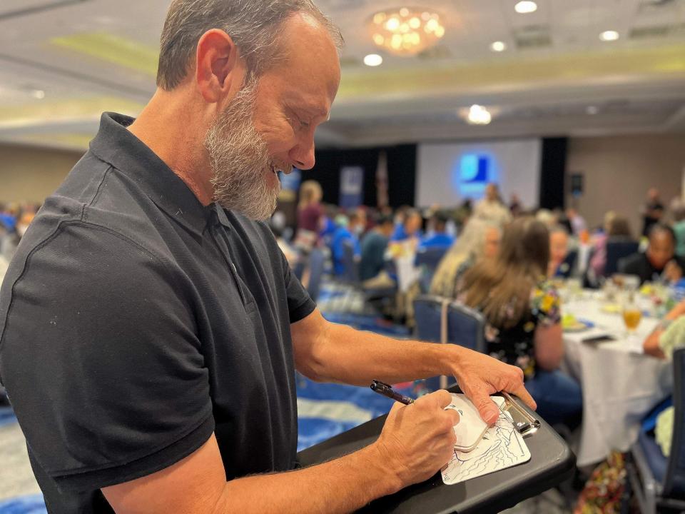 Goodwill Industries of Central Florida reception honors over 200 employees with guest speakers and a caricature artist.