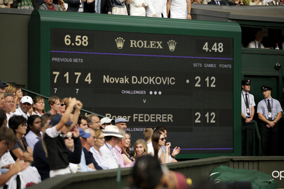 FILE - The scoreboard shows the 12 games all score in the final set during during the men's singles final match between Serbia's Novak Djokovic and Switzerland's Roger Federer at the Wimbledon Tennis Championships in London, on July 14, 2019. Every so often, a debate bubbles up around whether it makes sense for men to keep playing best-of-five-set matches at Wimbledon and other Grand Slam tournaments. Consider Novak Djokovic a staunch advocate for keeping the format — at least in the latter stages of majors. (AP Photo/Tim Ireland, File)