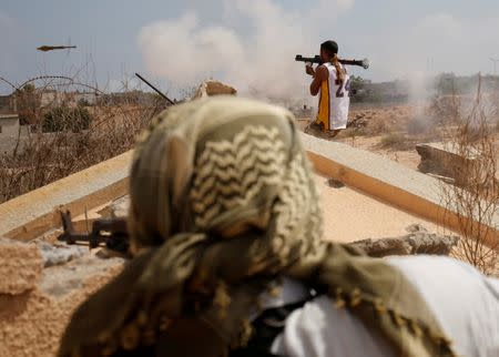 Libyan forces allied with the U.N.-backed government fire weapons during a battle with Islamic State fighters in Sirte. REUTERS/Goran Tomasevic