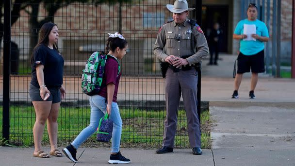 PHOTO: Students arrive at Uvalde Elementary, now protected by a fence and Texas State Troopers, for the first day of school, on Sept. 6, 2022, in Uvalde, Texas. (Eric Gay/AP)