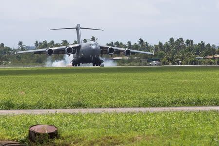 A Royal Australian Air Force C-17A aircraft lands at Fiji's Nausori International Airport near Suva to assist in Cyclone Winston recovery efforts, in this picture supplied by the Australian Defence Force, February 24, 2016. REUTERS/Australian Defence Force/Handout via Reuters