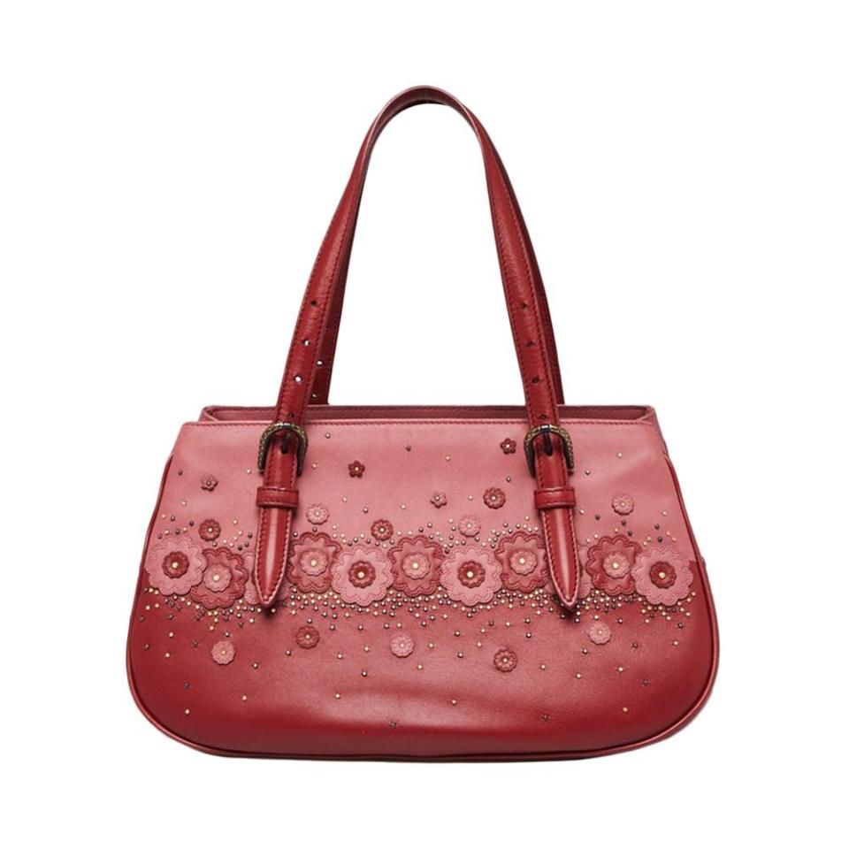 <p><a href="https://www.yoogiscloset.com/573823-bottega-veneta-red-pink-leather-studded-floral-applique-bag.html" rel="nofollow noopener" target="_blank" data-ylk="slk:Shop Now;elm:context_link;itc:0;sec:content-canvas" class="link ">Shop Now</a></p><p>Red/Pink Leather Studded Floral Applique Bag</p><p>yoogiscloset.com</p><p>$1275.00</p>