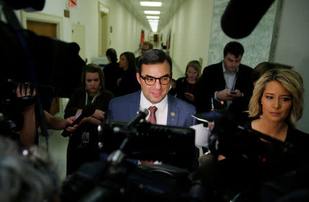 FILE PHOTO: House Freedom Caucus member Rep. Justin Amash (R-MI) talks to reporters on Capitol Hill after attending a White House meeting on the repeal of Obamacare in Washington, U.S., March 23, 2017. REUTERS/Jonathan Ernst/File Photo