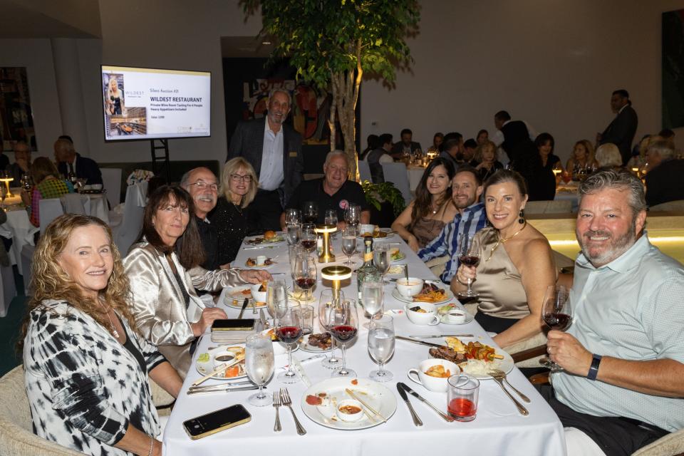 Desert Cancer Foundation’s board president Frank Harrison poses with his guests at Corks & Cuisine fundraiser on Nov. 4, 2023.