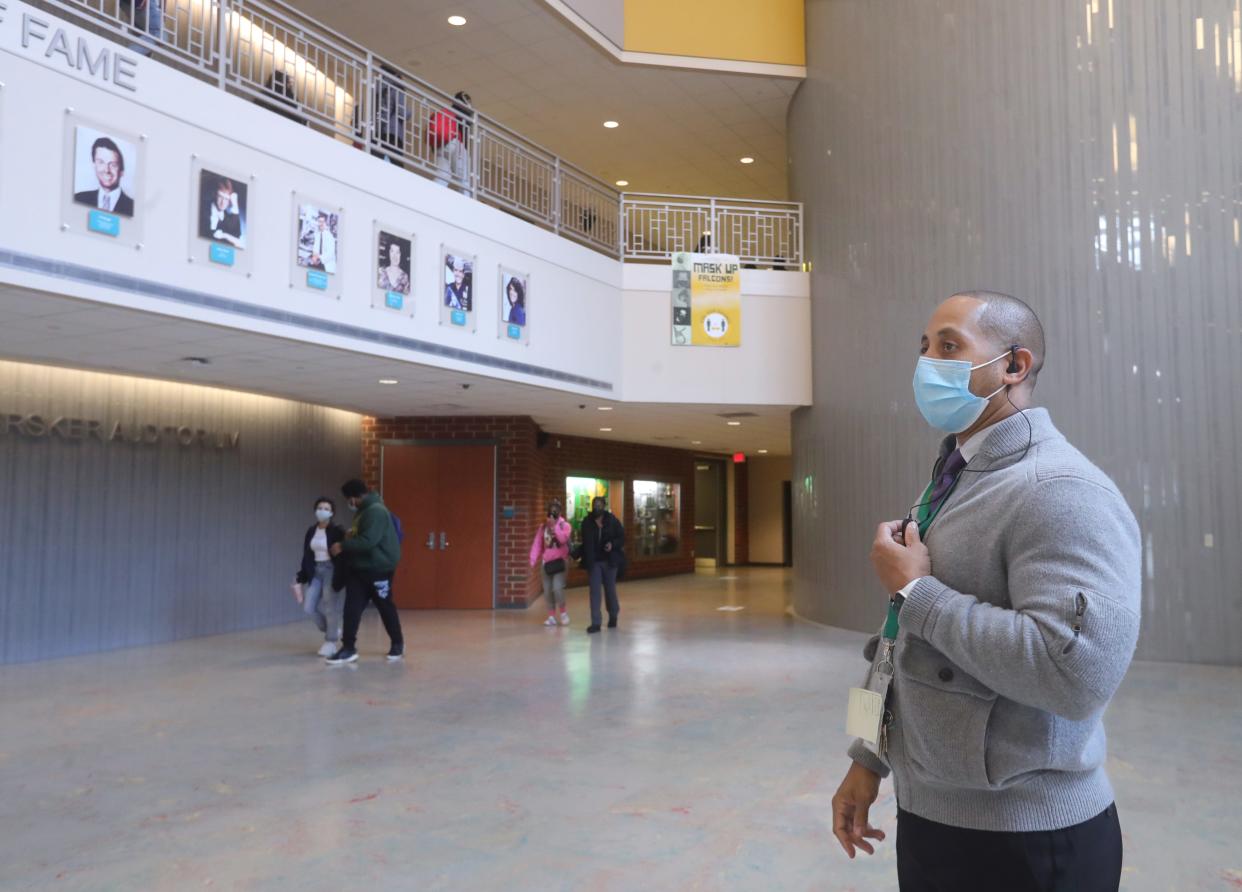 Firestone CLC Principal Larry Johnson monitors the commons area between classes on Thursday, Dec. 2, 2021 in Akron.