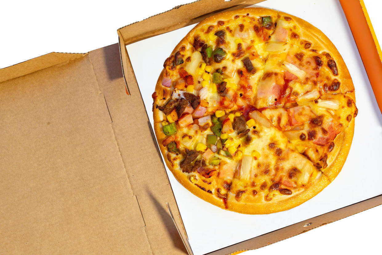 An open box of pizza.