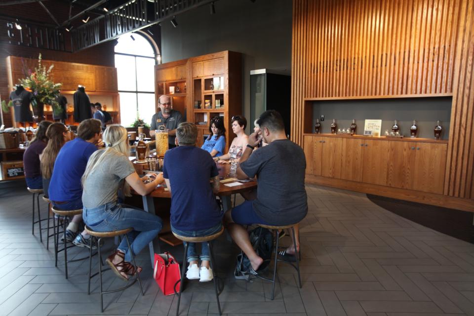 Visitors to the Angel's Envy distillery sample bourbon after a tour, Louisville, KY; Aug. 20, 2017 (Steve Stephens/Columbus Dispatch)