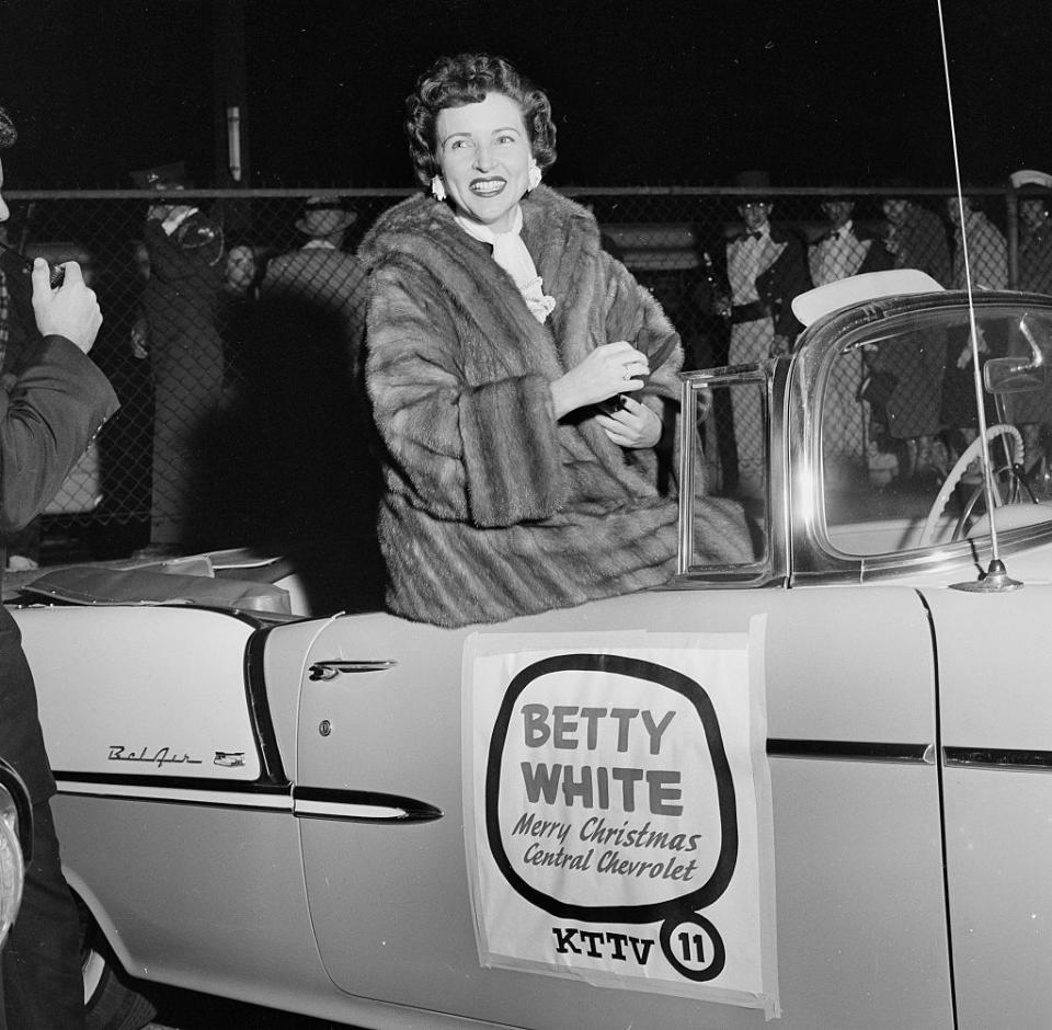 1955: White attends a Christmas Parade in Los Angeles.
