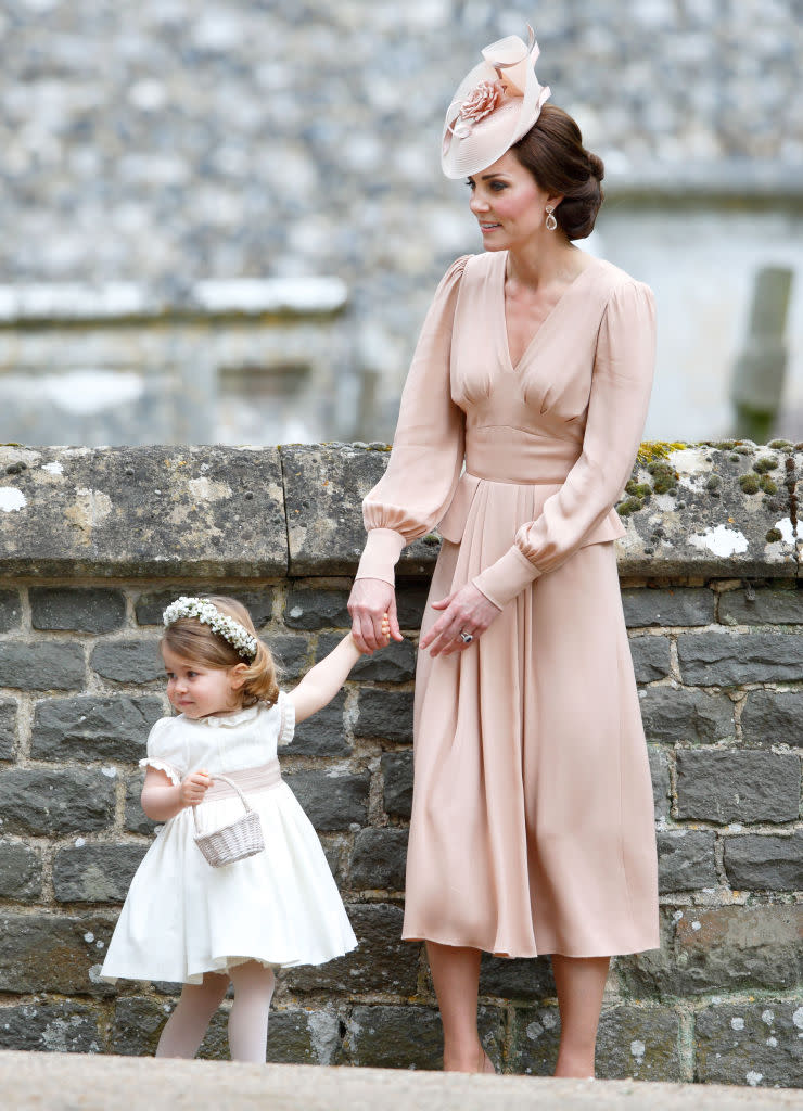 <p>The Duchess of Cambridge wore a blush-hued dress by Alexander McQueen for her sister Pippa Middleton’s wedding on May 20, 2017. <em>[Photo: Getty]</em> </p>