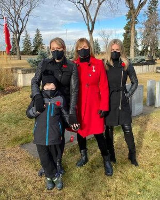 Maureen Bianchini Purvis with her daughters and grandson at Edmonton's Beechmount Cemetery in November 2020.