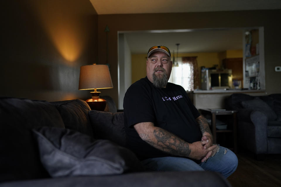 Cory Kinn, men's home coordinator and criminal justice liaison at FOCUS Recovery and Wellness Community, sits in the men's recovery house living room in Findlay, Ohio, Friday, Oct. 20, 2023. FOCUS offers free support and resources to anyone impacted by mental health, addiction, or trauma issues. The group runs three recovery houses. (AP Photo/Carolyn Kaster)