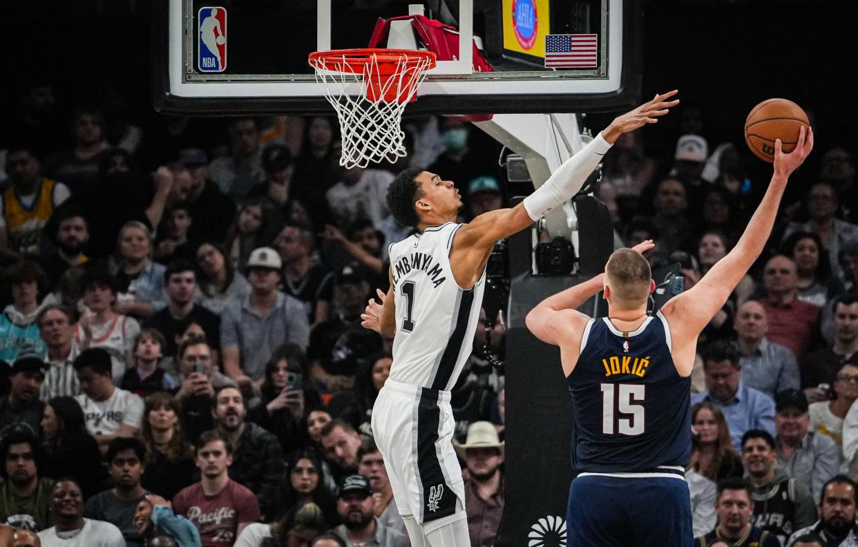 Victor Wembanyama defends against Denver star Nikola Jokic in the second quarter of the Spurs' I-35 series game at Moody Center on Friday. Wembanyama scored 17 points in the 117-106 loss.