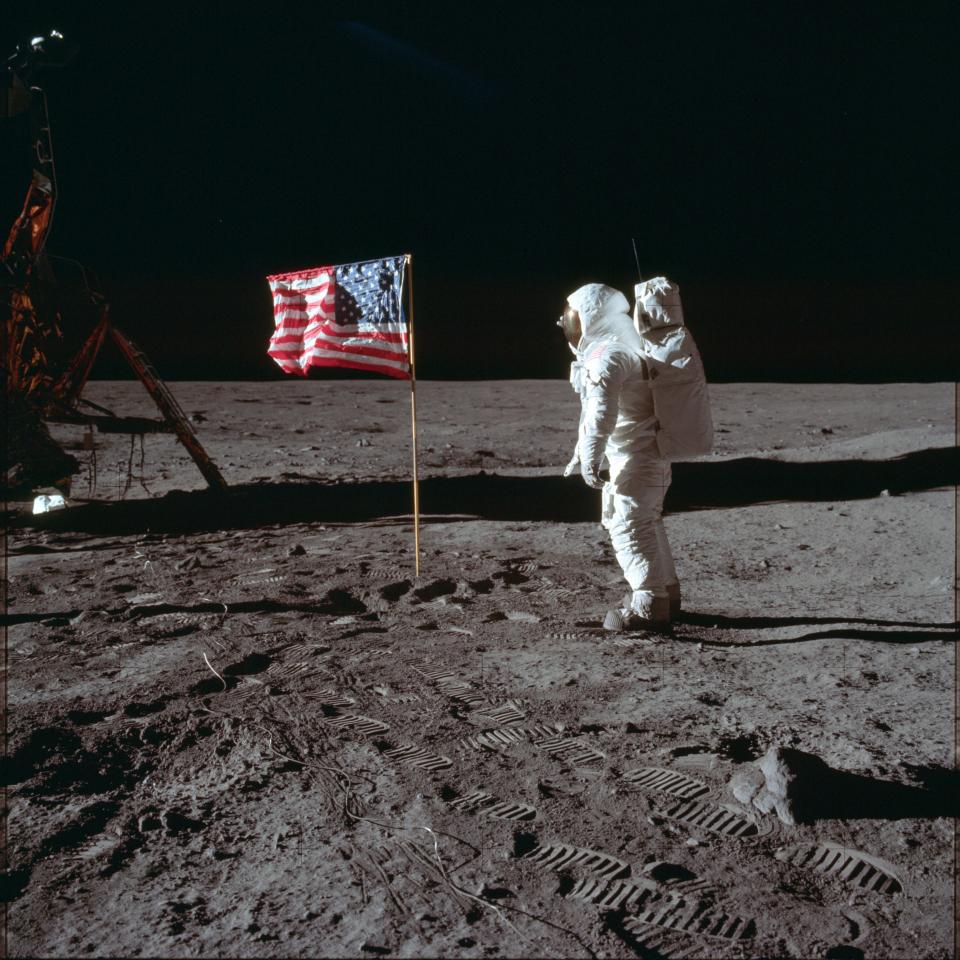 ADVANCE FOR USE SATURDAY, JULY 13, 2019 AND THEREAFTER-In this July 20, 1969 photo made available by NASA, astronaut Buzz Aldrin Jr. poses for a photograph beside the U.S. flag on the moon during the Apollo 11 mission. Aldrin and fellow astronaut Neil Armstrong were the first men to walk on the lunar surface with temperatures ranging from 243 degrees above to 279 degrees below zero. Astronaut Michael Collins flew the command module. (Neil Armstrong/NASA via AP) ORG XMIT: NYMO411