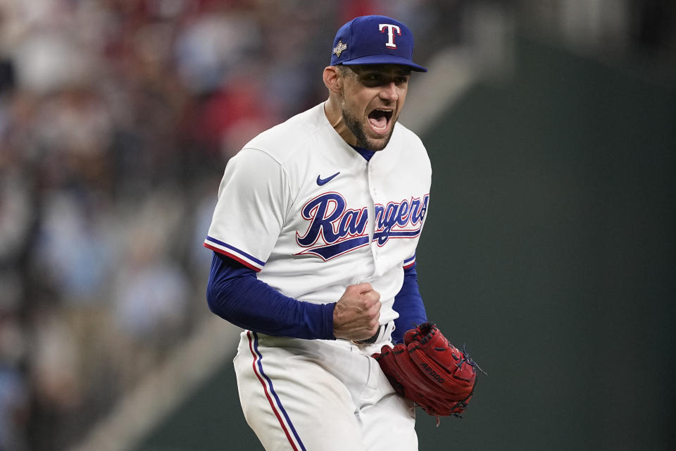 Texas Rangers starting pitcher Nathan Eovaldi celebrates after striking out Baltimore Orioles' Jordan Westburg in the seventh inning of Game 3 of a baseball AL Division Series on Tuesday, Oct. 10, 2023, in Arlington, Texas. (AP Photo/Tony Gutierrez )