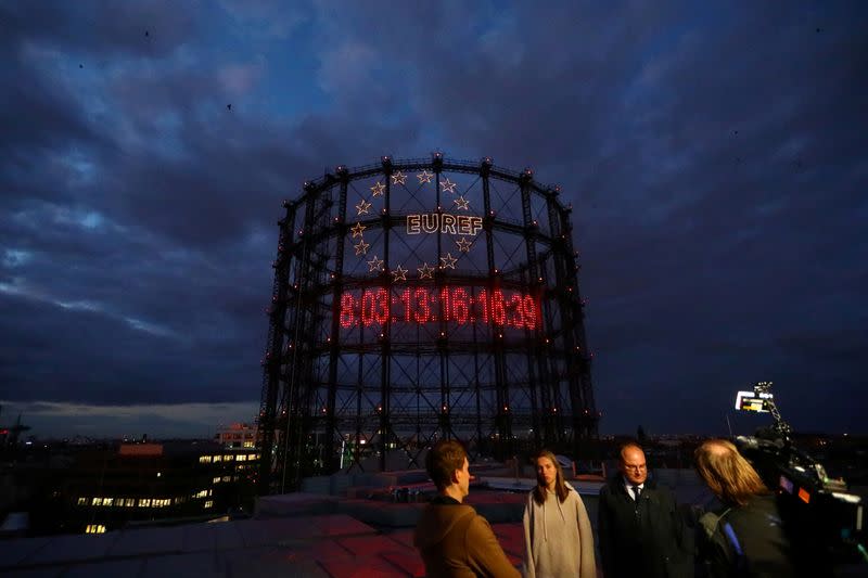 FILE PHOTO: Young activists install giant "carbon clock" at former gasometer in Berlin