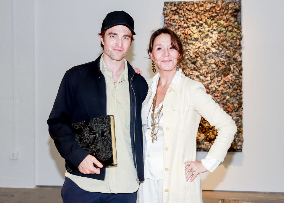 Robert Pattinson and artist Ingrid Donat. - Credit: River Callaway/BFA.com