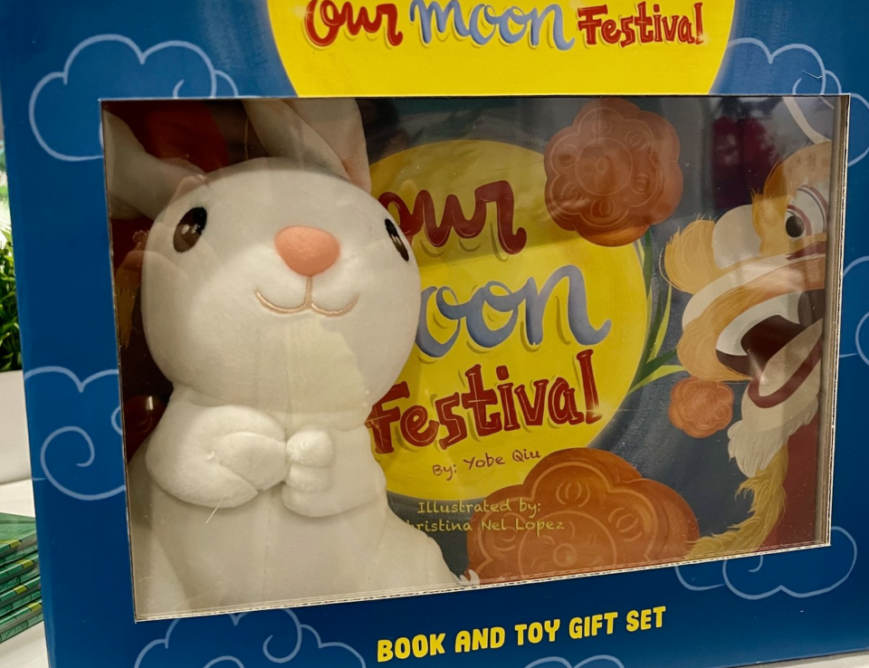 Blue box with toy bunny and "Our Moon Festival" book.