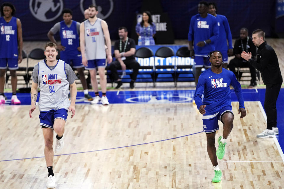 Baylor Scheierman, left, and Bronny James warm up during the 2024 NBA basketball Draft Combine in Chicago, Tuesday, May 14, 2024. (AP Photo/Nam Y. Huh)