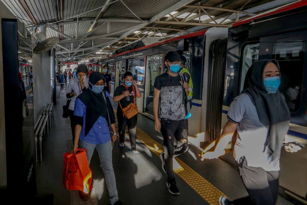 Commuters disembark at the Maluri MRT station on the first day of the conditional movement control order in Kuala Lumpur May 4, 2020. — Picture by Firdaus Latif