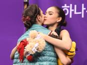 <p>Russia’s Alina Zagitova (R) hugs Russia’s Evgenia Medvedeva after the women’s single skating free skating of the figure skating event during the Pyeongchang 2018 Winter Olympic Games at the Gangneung Ice Arena in Gangneung on February 23, 2018. / AFP PHOTO / Roberto SCHMIDT </p>