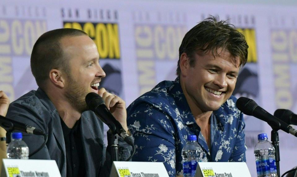 Aaron Paul (left) shares a laugh with co-star Luke Hemsworth during the 