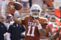 Texas quarterback Casey Thompson (11) looks to pass against Texas Tech during the first half of an NCAA college football game on Saturday, Sept. 25, 2021, in Austin, Texas. (AP Photo/Chuck Burton)