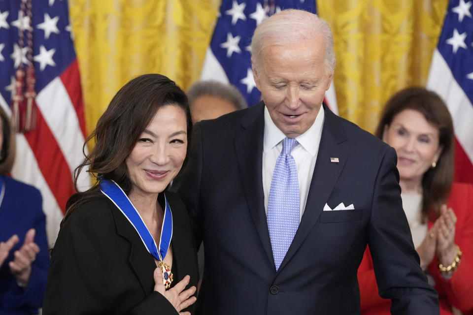 President Joe Biden awards the nation's highest civilian honor, the Presidential Medal of Freedom, to Michelle Yeoh during a ceremony in the East Room of the White House, Friday, May 3, 2024, in Washington. (AP Photo/Alex Brandon)