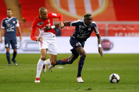 Soccer Football - Coupe de la Ligue Semi Final - AS Monaco vs Montpellier - Stade Louis II, Monaco - January 31, 2018 Monaco's Fabinho in action with Montpellier’s Junior Sambia REUTERS/Eric Gaillard