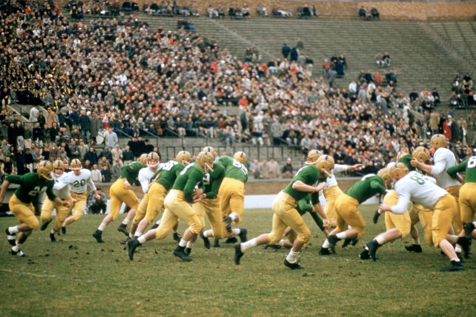 Notre Dame dons their famous green jerseys during an alumni game - 1957