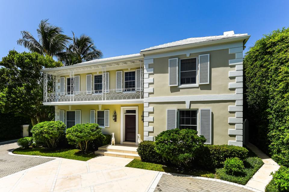 Dating to 1928, a remodeled Monterey-style house at 130 Cocoanut Row in Palm Beach sold in June a recorded $16.2 million. The house is seen here in a photo taken before that sale.