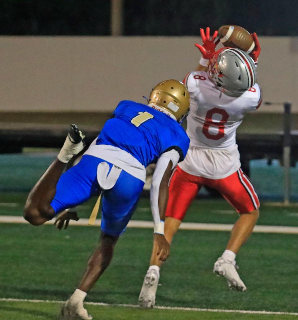 Caden Harshbarger (8) catches a touchdown ball for Lake Mary during Friday nights game against Mainland on November 3, 2023 .