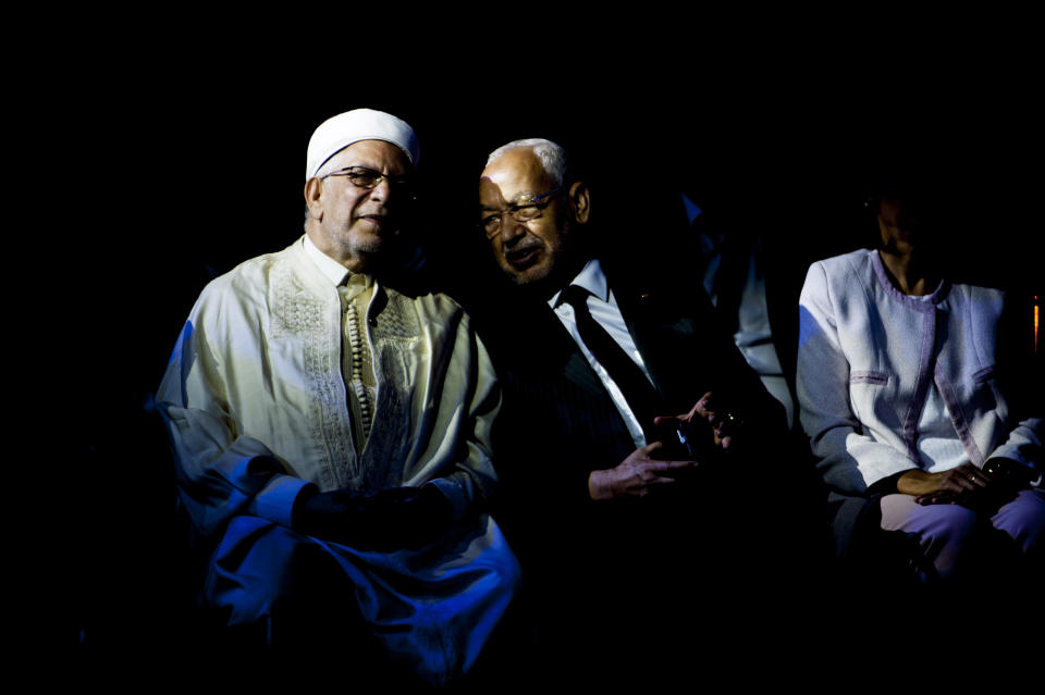 Vice President of the Islamist party Ennahda and candidate for the upcoming presidential elections Abdelfattah Mourou, left, speaks with Leader of the Islamist Ennahda party Rachid Ghannouchi during a meeting with the members of the party in Tunis, Tunisia, Friday, Aug. 30, 2019. (AP Photo/Hassene Dridi)