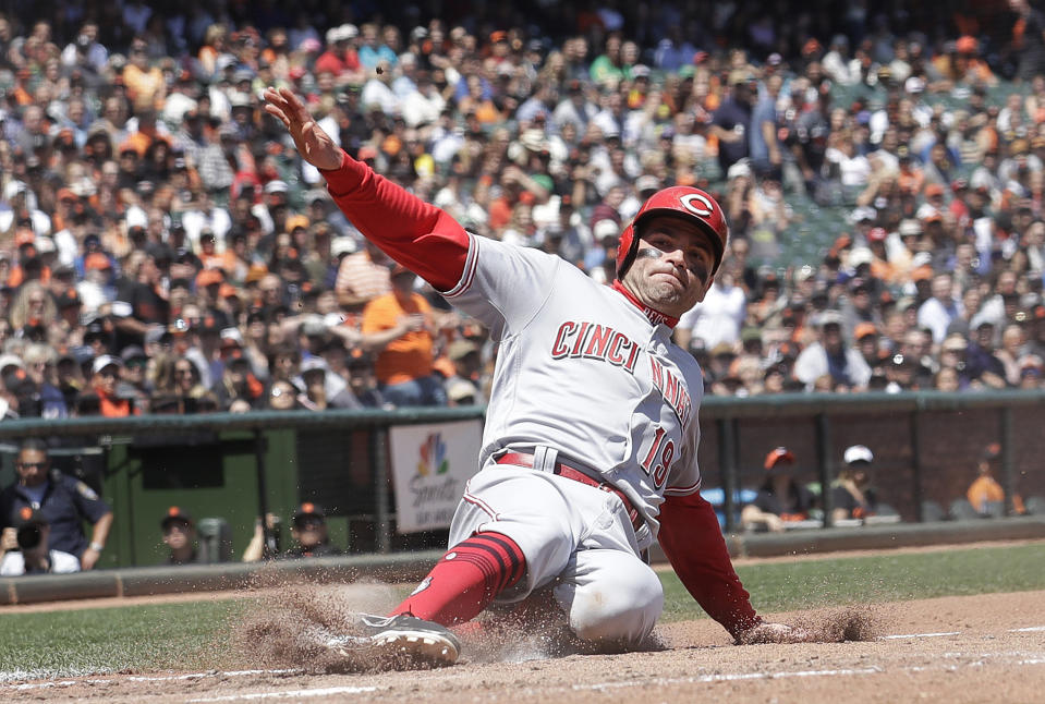 Cincinnati Reds’ Joey Votto had some fun with a pop up in Saturday’s meeting with the Cubs. (AP Photo)