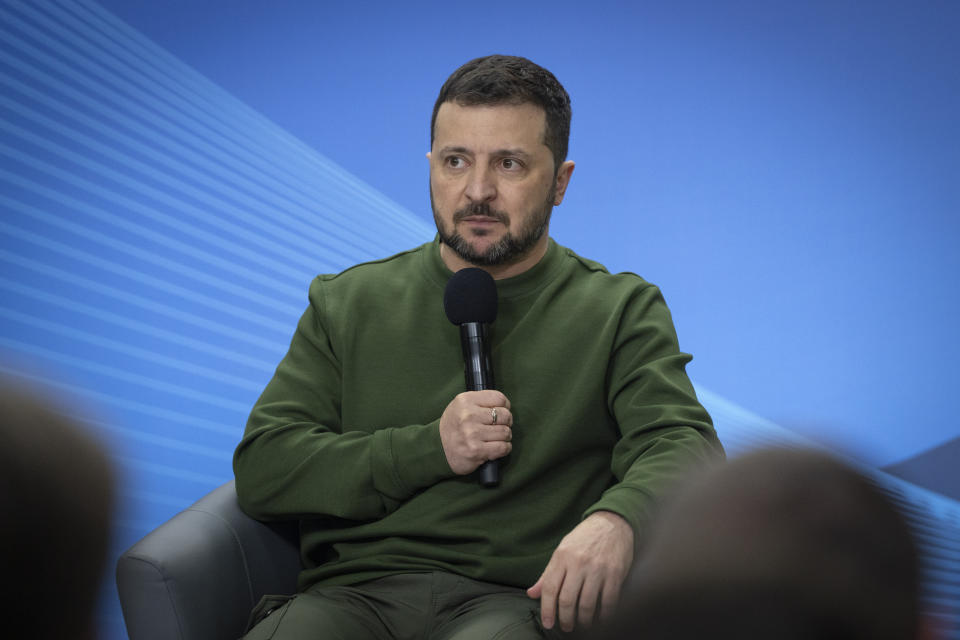 Ukrainian President Volodymyr Zelensky addresses the students during Poland's Prime Minister Donald Tusk visit to Kyiv, Ukraine, Monday, Jan. 22, 2024. (AP Photo/Efrem Lukatsky)