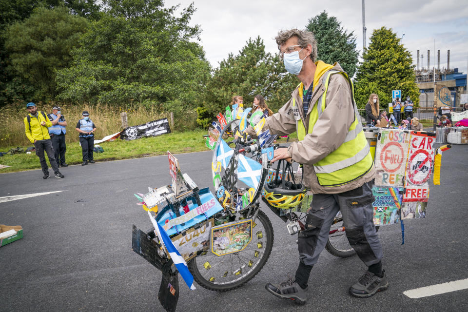 <p>Climate activists demonstrating outside the gates of the Mossmorran petrochemical refinery near Cowdenbeath to protest against flaring and pollution at the plant. Picture date: Sunday August 1, 2021.</p>
