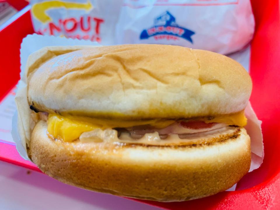 In-n-out grilled cheese in red tray wrapped in white parchment wrapper