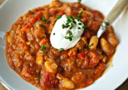 <div class="caption-credit"> Photo by: Photo by Ashley Rodriguez</div><b>Spicy Sausage and Pumpkin Chili</b> <br> Brown spicy Italian sausage in a dutch oven and pour off the excess fat. Stir in chopped onions and bell peppers, chili powder, cumin and a pinch of crushed red pepper flakes; cook until the vegetables are just softened. Stir in cannellini beans, fire-roasted canned tomatoes with their juice and canned pumpkin. Simmer for 20 minutes. Serve with sour cream, sliced scallions and shredded Monterey Jack cheese. <br> <i>RECIPE BY Teri Tsang Barrett</i>