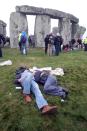 Crowds gather at dawn amongst the stones at Stonehenge in Wiltshire for the Summer Solstice.