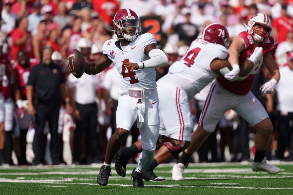 Sep 14, 2024; Madison, Wisconsin, USA; Alabama Crimson Tide quarterback Jalen Milroe (4) throws a pass during the first quarter against the Wisconsin Badgers at Camp Randall Stadium. Mandatory Credit: Jeff Hanisch-Imagn Images