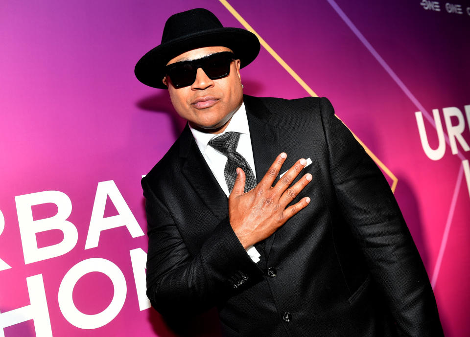 ll cool j in a black suit and hat on red carpet