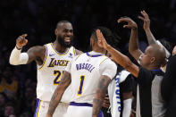 Los Angeles Lakers forward LeBron James, left, complains about a foul call against him as guard D'Angelo Russell looks on during the second half in Game 4 of an NBA basketball first-round playoff series against the Denver Nuggets Saturday, April 27, 2024, in Los Angeles. (AP Photo/Mark J. Terrill)