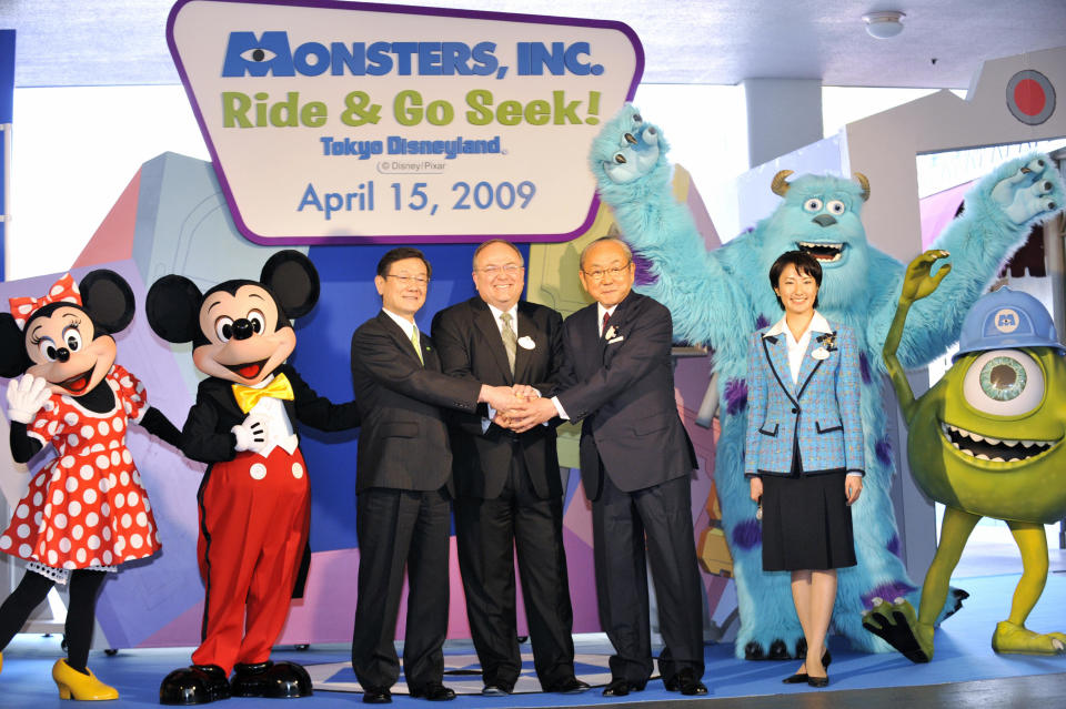 Minnie Mouse, Mickey Mouse, and Monsters, Inc. characters celebrate the launch of "Monsters, Inc. Ride & Go Seek!" at Tokyo Disneyland on April 15, 2009, with park officials