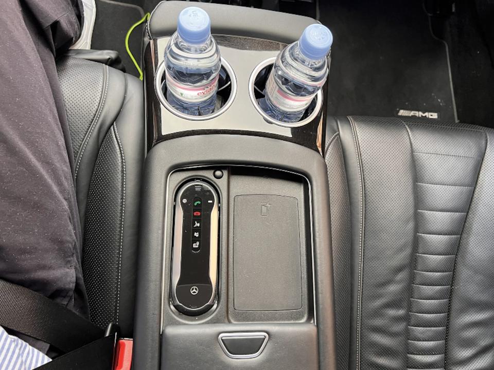 A view of the wireless charging pad between the two back seats.