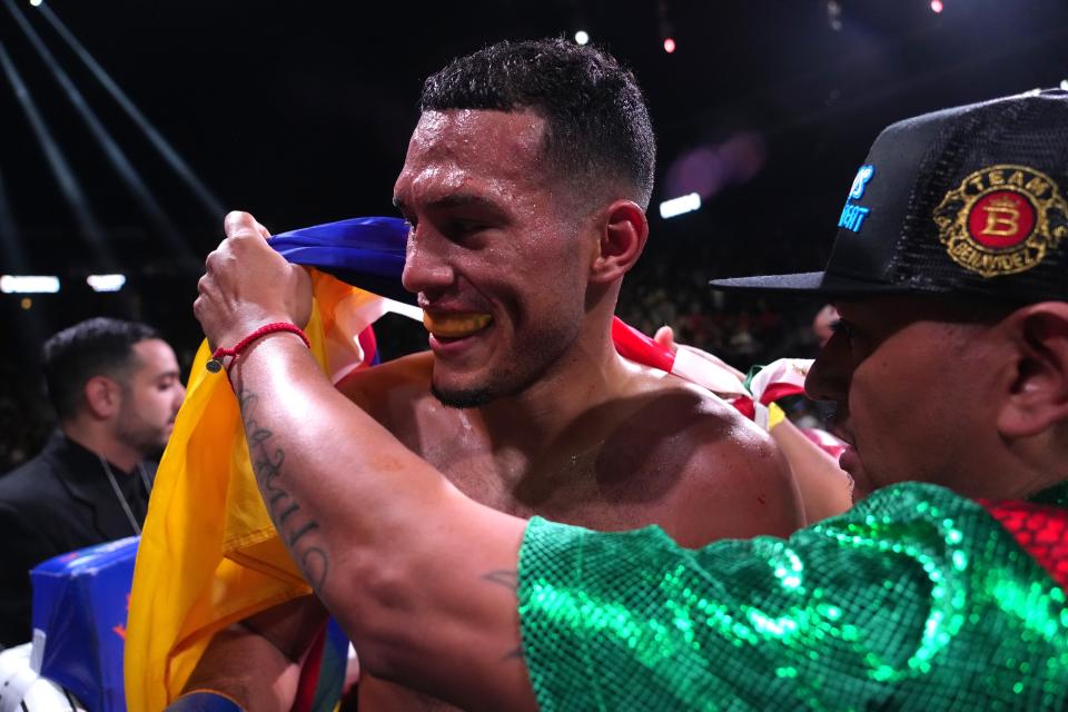 May 21, 2022; Glendale, Arizona, USA; David Benavidez (red trunks) celebrates after defeating David Lemieux (not pictured) during their Interim WBC World Super Middleweight Championship boxing match during a Premier Boxing Champions card at Gila River Arena.