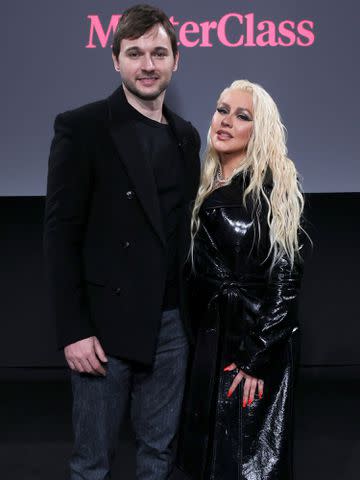 <p>Cindy Ord/Getty</p> Matt Rutler and Christina Aguilera at the MasterClass First Look Event at The Whitney Museum of American Art in November 2021.
