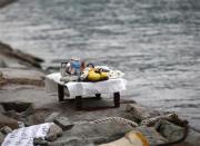 An altar with prayer offerings for missing passengers onboard South Korean ferry Sewol, which capsized on Wednesday, is seen next to the sea at a port where family members of missing passengers are waiting for news from rescue and salvage teams in Jindo April 22, 2014. REUTERS/Kim Kyung-Hoon