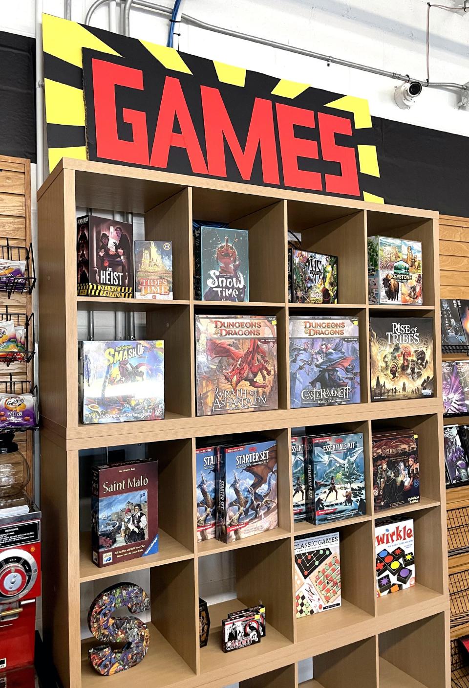 Sets of Dungeons & Dragons, a fantasy role-playing game, are featured on shelves, along with other games at Sanctuary Comics & Games in Edmond.