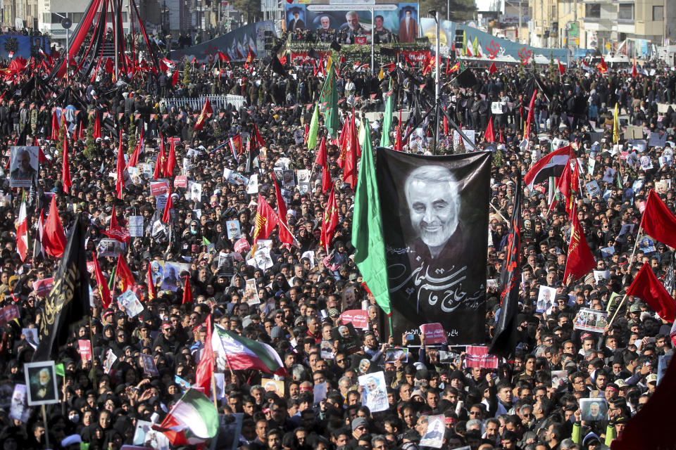 Mourners attend a funeral ceremony for Iranian Gen. Qassem Soleimani in Kerman, Iran, Tuesday. (Erfan Kouchari/Tasnim News Agency via AP)