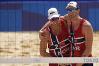 Anders Bernsten Mol, right, of Norway, and teammate Christian Sandle Sorum celebrate winning a men's beach volleyball quarterfinal match against the Russian Olympic Committee at the 2020 Summer Olympics, Wednesday, Aug. 4, 2021, in Tokyo, Japan. (AP Photo/Petros Giannakouris)