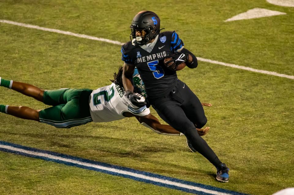Memphis tight end Sean Dykes evades a defender in the Tigers' 33-28 win over Tulane